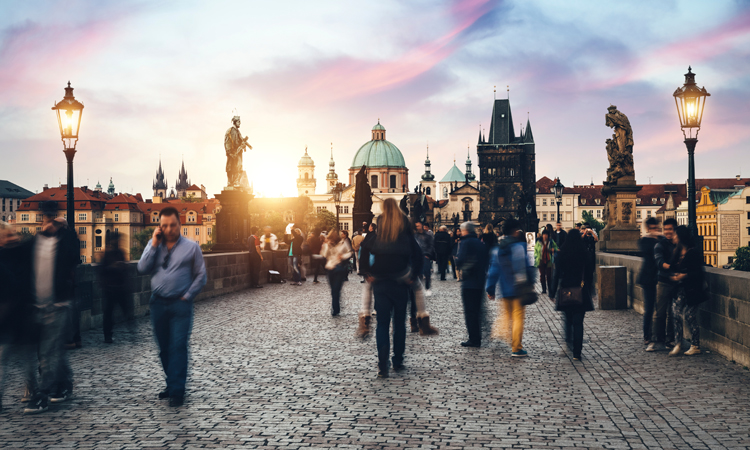 Czech citizens and tourists walking across bridge