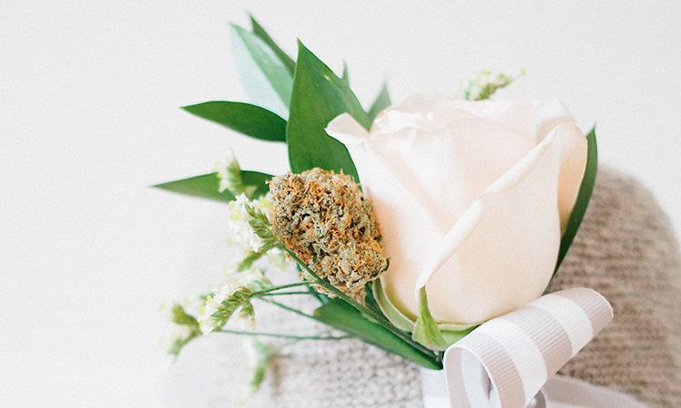 Cannabis boutonnière with white rose on hemp hat
