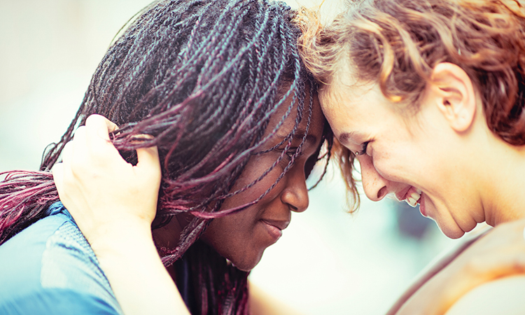 Lesbian couple embracing tenderly