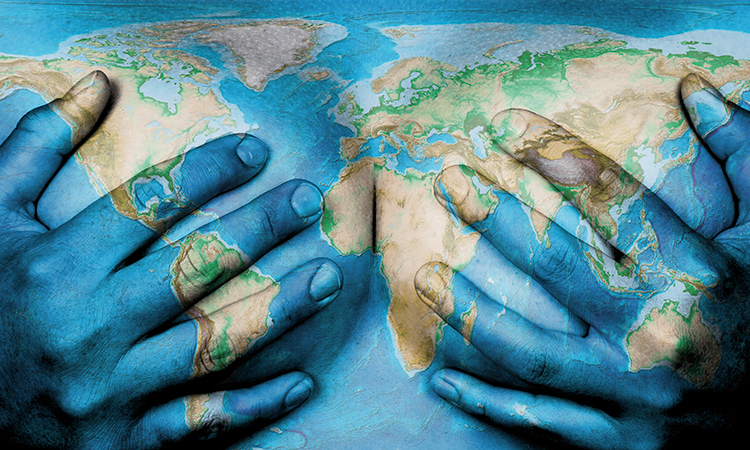 World map projected onto hands covering breasts