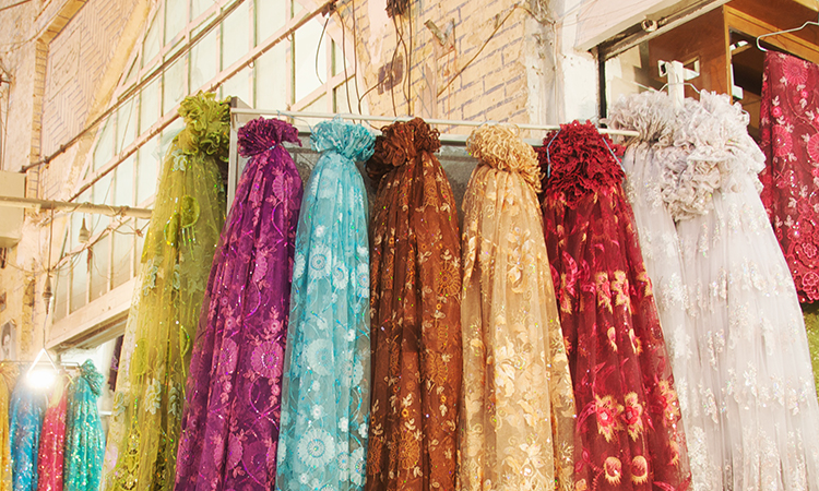 Colorful synthetic scarves at market