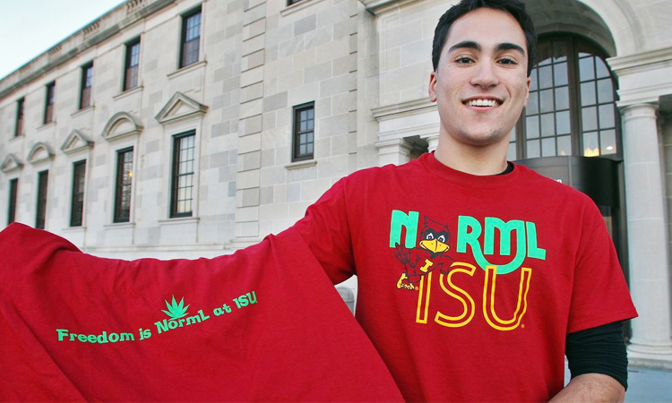 Iowa State University student holding NORML cannabis t-shirt