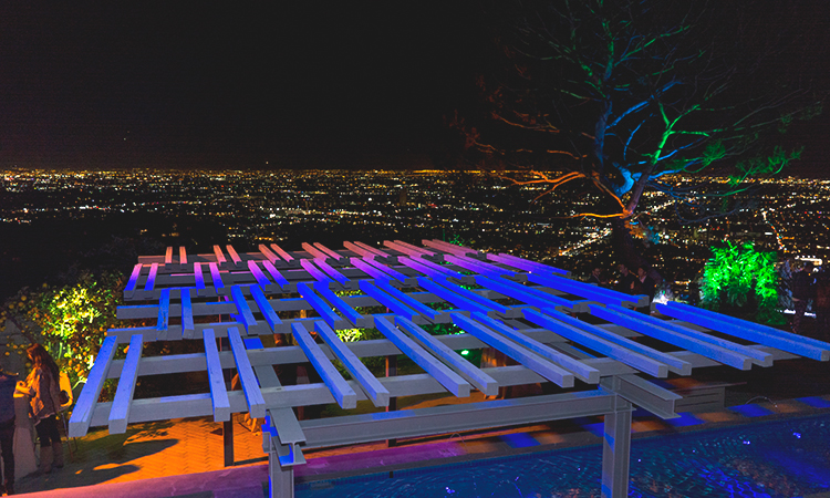 A lighted rooftop overlooking the city of Los Angeles