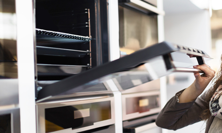 Woman opening an oven