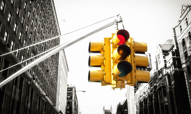Red stop light in city